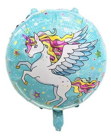 Unicorn balloon next to other party decorations on a table