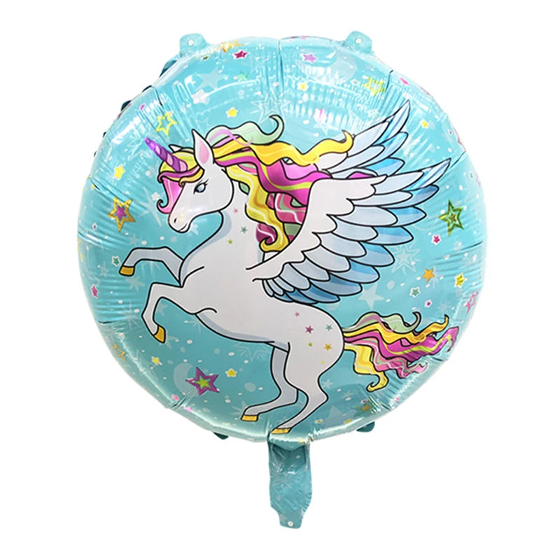 Unicorn balloon next to other party decorations on a table