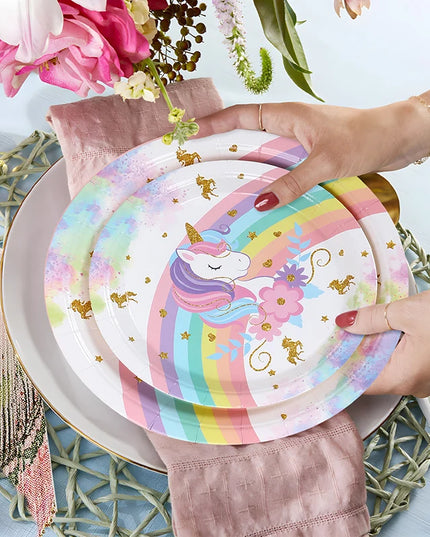 Close-up of the gold unicorn and star print on the white tablecloth