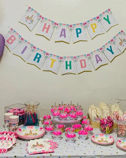 Single unicorn paper plate seen from above on a party table