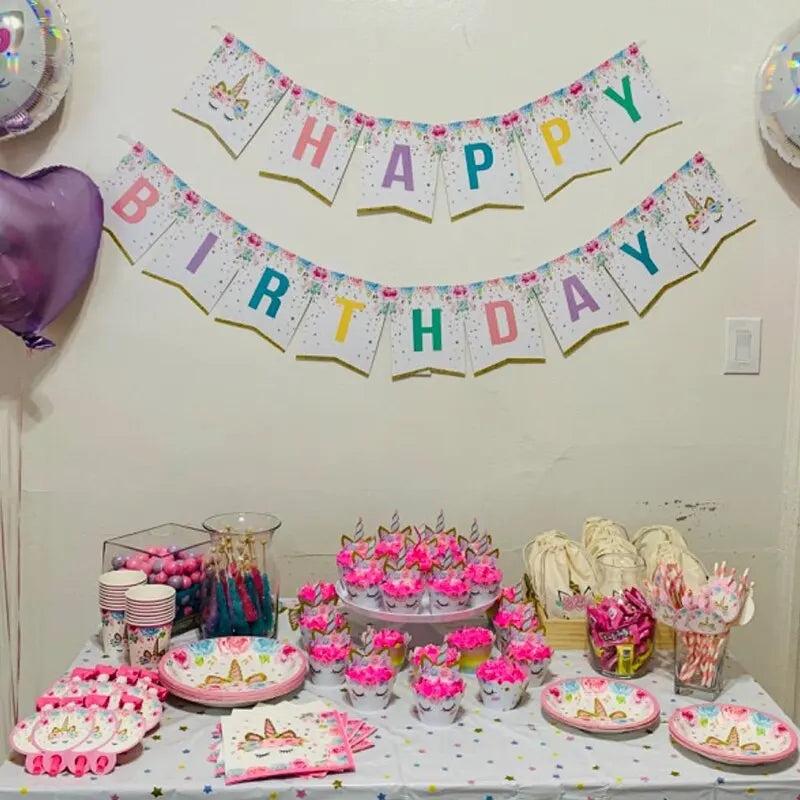 Stack of white unicorn party plates for a birthday table