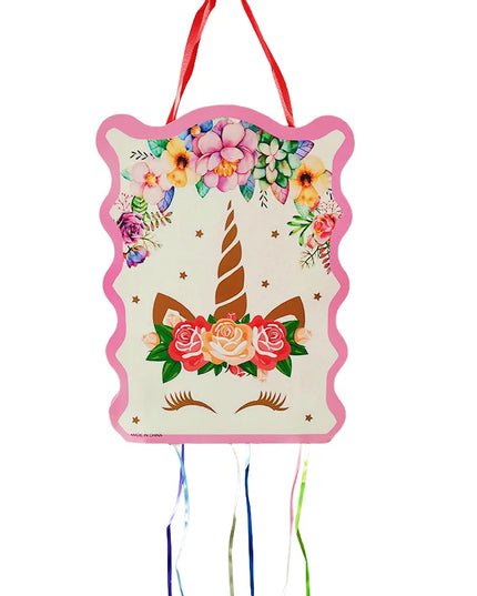 Pink unicorn pinata with gold horn, flower crown and colorful pull ribbons