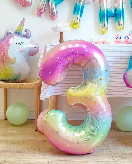 Pastel pink and rainbow mane detail of the unicorn balloon