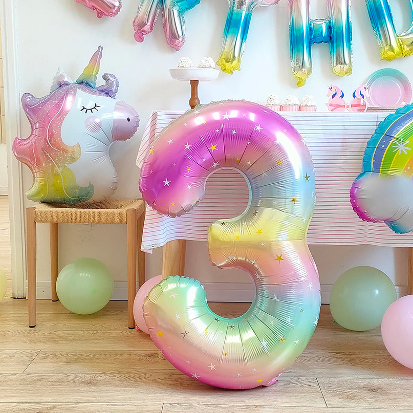 Unicorn foil balloon hanging as a party decoration for a birthday