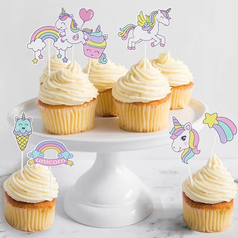 Rainbow unicorn paper plates next to matching party decorations