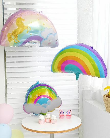 Unicorn balloon with closed eyes and gold horn on a balloon stick