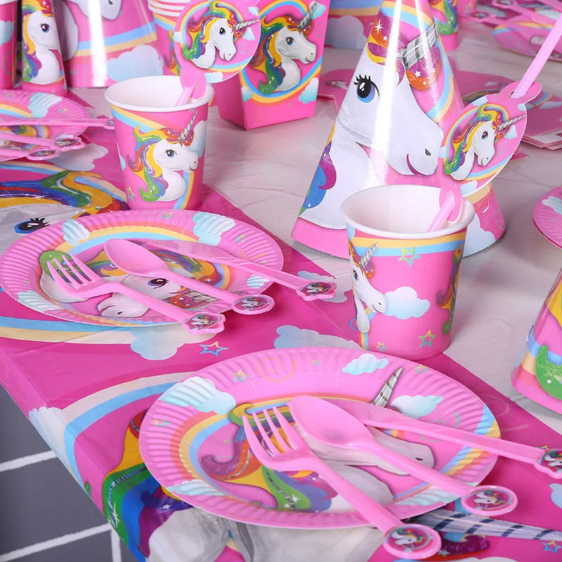 Pink unicorn birthday plate with cake and party snacks