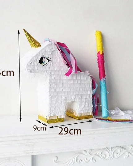 White unicorn pinata with gold horn and pink and blue mane