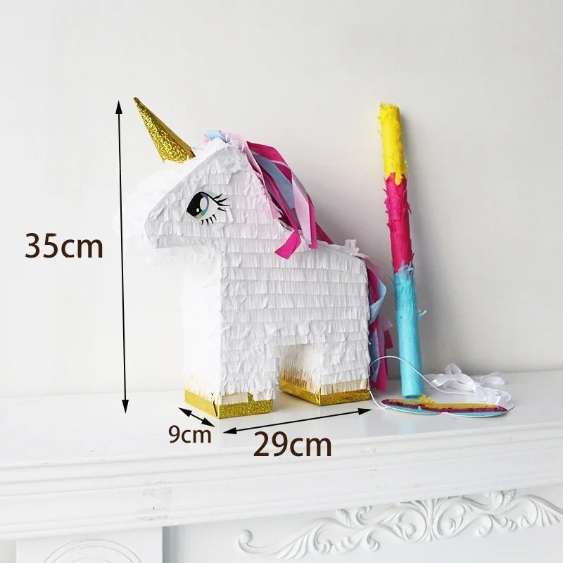 White unicorn pinata with gold horn and pink and blue mane