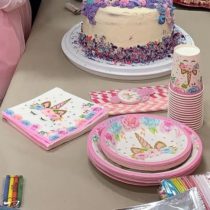Close up of unicorn face on white paper party plate with pink flowers