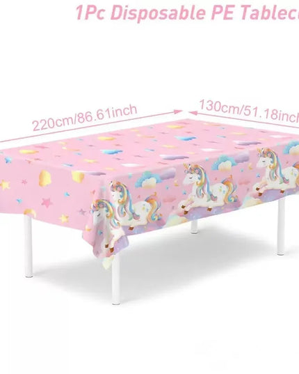 Pink Unicorn tablecloth with unicorns, clouds and hearts on a party table
