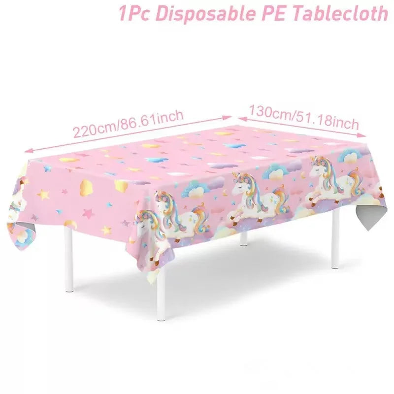Pink Unicorn tablecloth with unicorns, clouds and hearts on a party table