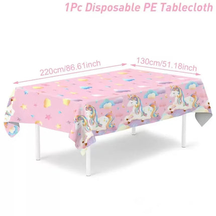Pink Unicorn tablecloth with unicorns, clouds and hearts on a party table