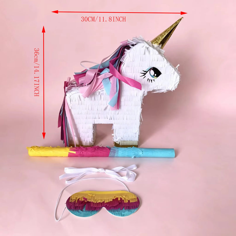 Close-up of the golden horn and pink fringe mane on the white unicorn pinata