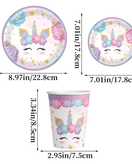 Stack of pink unicorn paper plates for a birthday party table