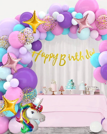 Finished pastel balloon arch styled for a unicorn birthday party