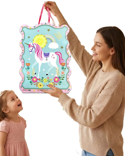 Close-up of the unicorn face and rainbow print on the pinata