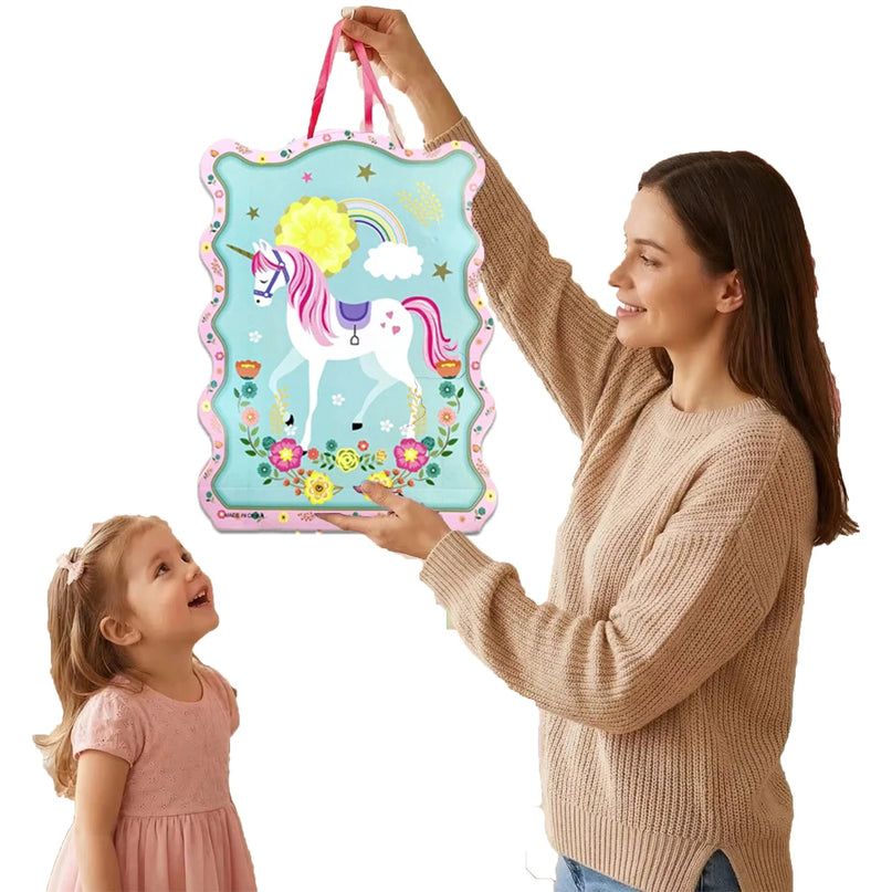 Close-up of the unicorn face and rainbow print on the pinata