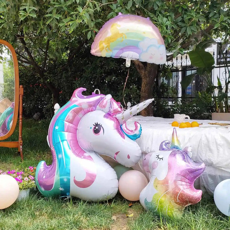 40 inch unicorn foil balloon shown next to party decorations