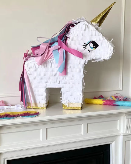 White hanging tie and strap on the unicorn pinata ready to hang