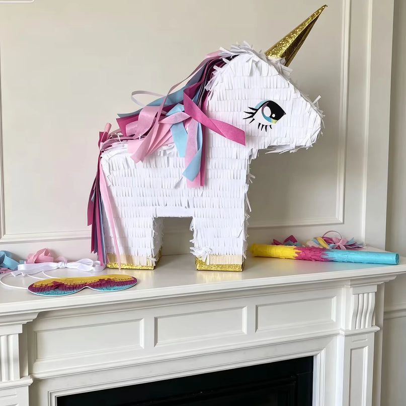 White hanging tie and strap on the unicorn pinata ready to hang