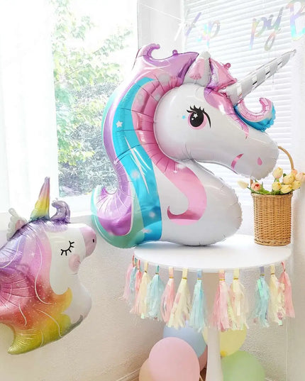 Close view of the closed eyes and pink cheeks on the unicorn foil balloon