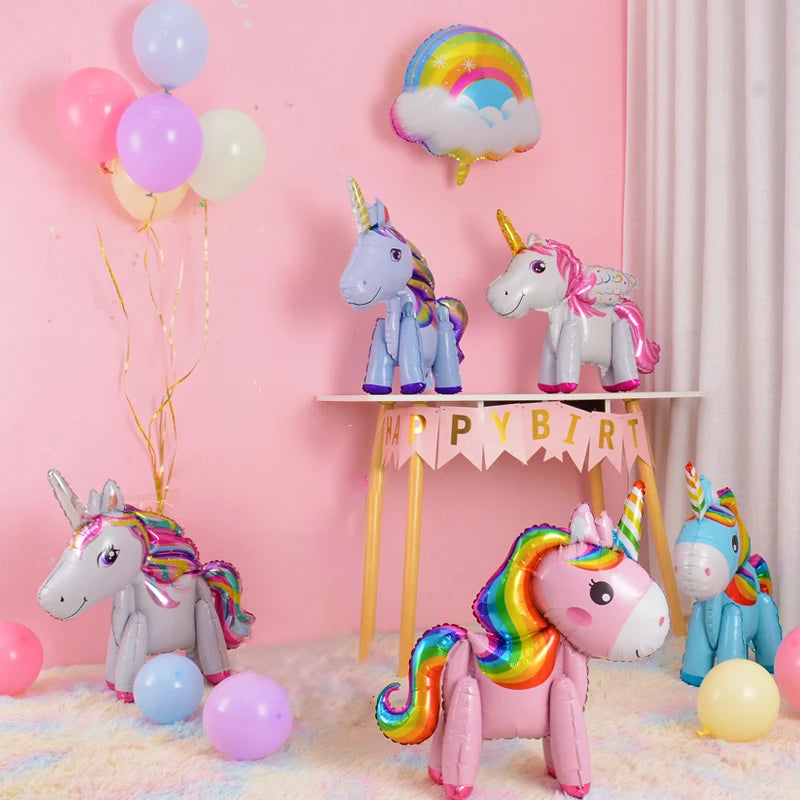 Standing 3D unicorn foil balloon in pink on a party table