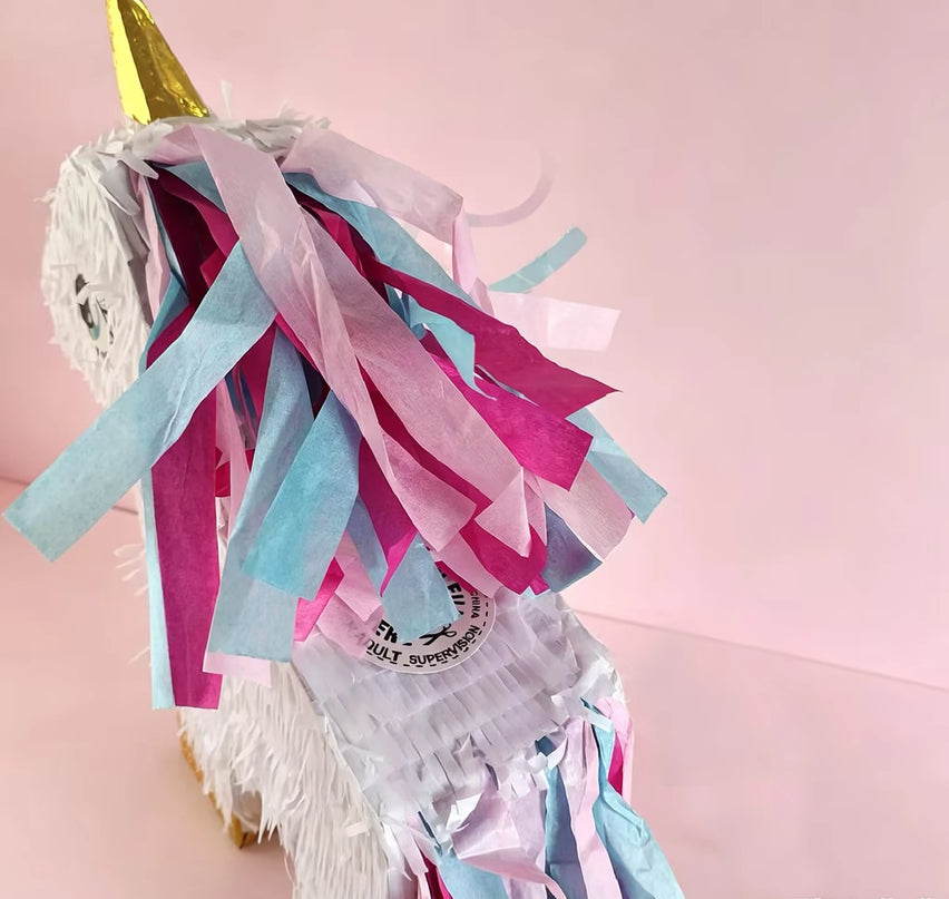 Golden hooves and turquoise tail detail on the white unicorn pinata