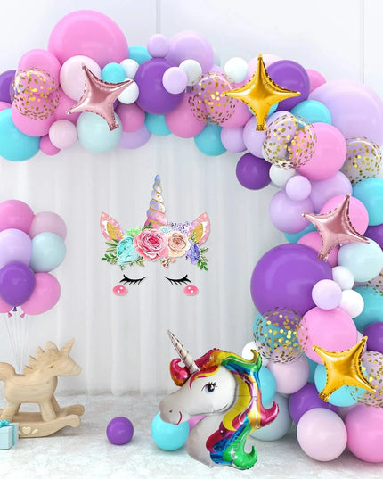 Unicorn head foil balloon as the centerpiece of the arch