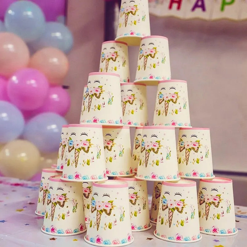 White paper plates with unicorn motif and pink dotted rim