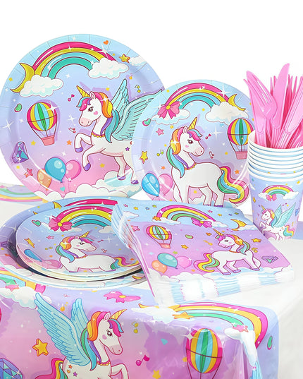 Complete unicorn tableware set laid out for a birthday party