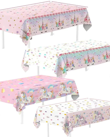 Close-up of the unicorn tablecloth showing sleeping unicorn faces and star print along the edge