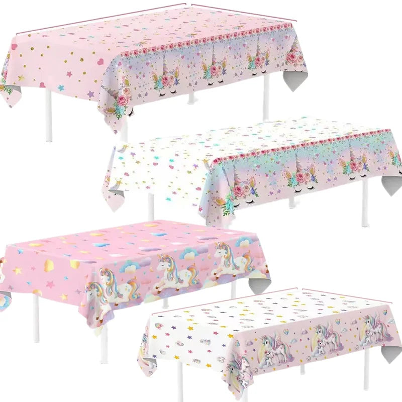 Close-up of the unicorn tablecloth showing sleeping unicorn faces and star print along the edge
