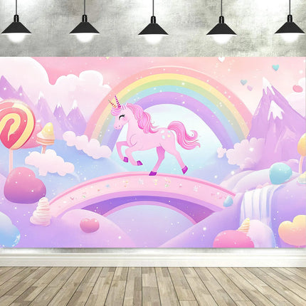 Pink rainbow unicorn backdrop with lollipops, clouds and lavender mountains