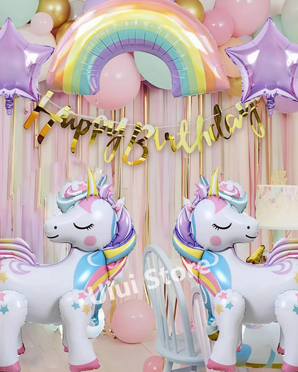Unicorn and rainbow paper plates stacked for a party