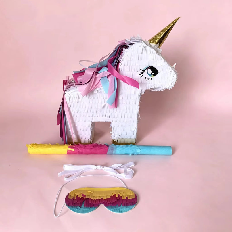 Unicorn pinata filled with candy for a birthday party game