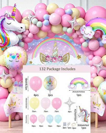 Pink rainbow unicorn balloon arch with unicorn and star foil balloons over a party backdrop