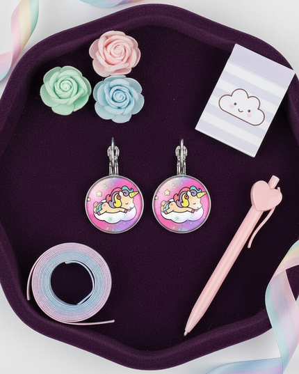 big unicorn earrings - flat-lay