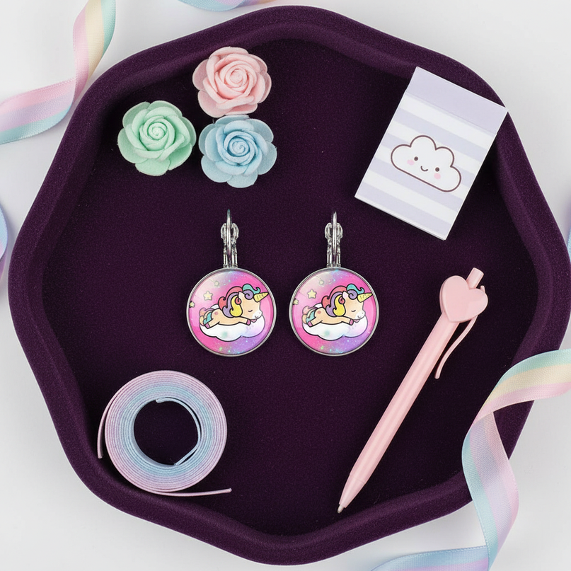 big unicorn earrings - flat-lay