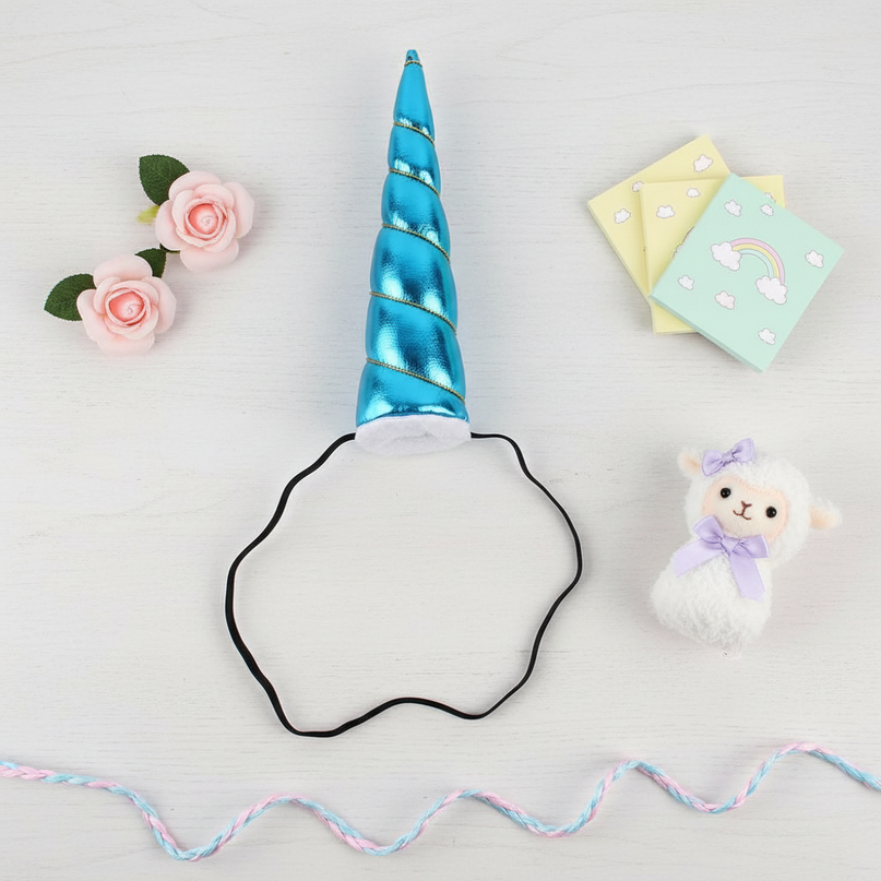 blue elastic unicorn horn - flat-lay