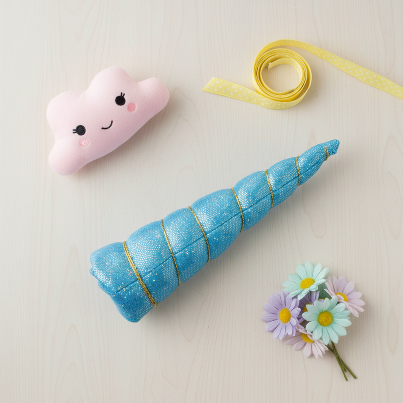 blue felt unicorn horn set - flat-lay