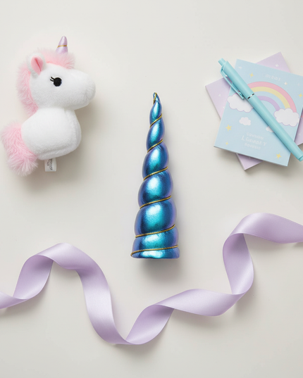 blue iridescent unicorn horn - flat-lay