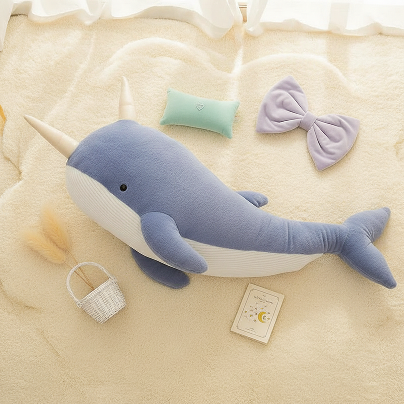blue narwhal plush - flat-lay