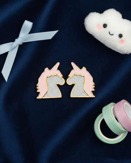 charming unicorn earrings - flat-lay