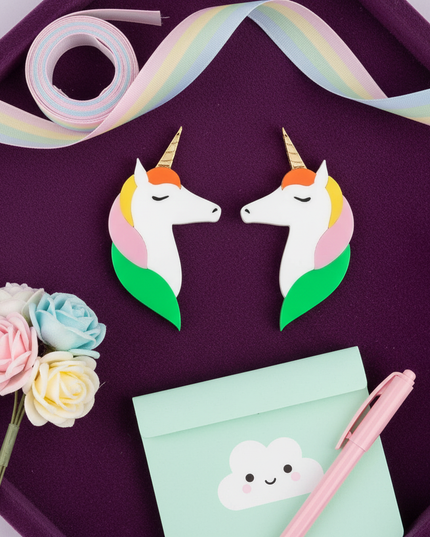 cool unicorn earrings - flat-lay