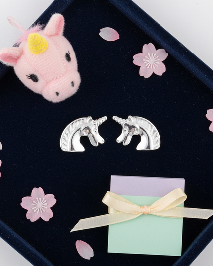 copper unicorn earrings - flat-lay