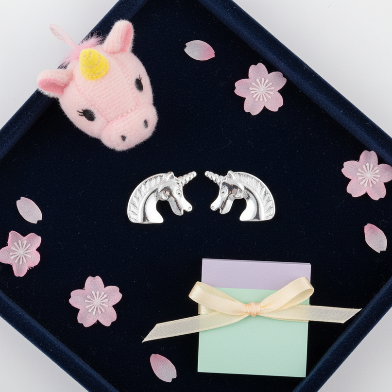 copper unicorn earrings - flat-lay