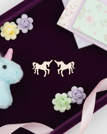 dainty unicorn earrings - flat-lay
