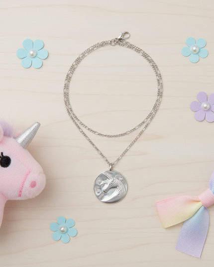 flower unicorn necklace - flat-lay