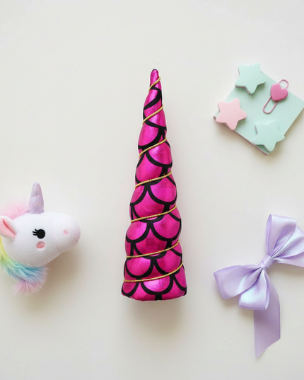 fuchsia mermaid unicorn horn - flat-lay